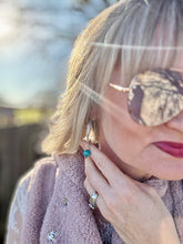 The ornate earrings