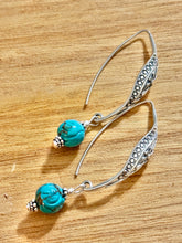 The ornate earrings