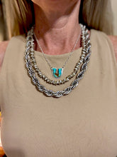 The silver spur necklace