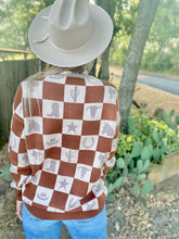 The wild checkmate sweater