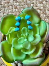 The Turquoise ear climber