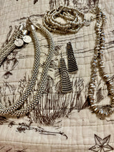 The silver spur necklace