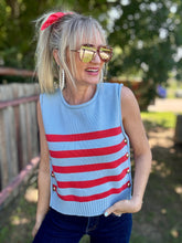 Woman wearing a sleeveless striped shirt outdoors