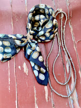 saddle scarf slide